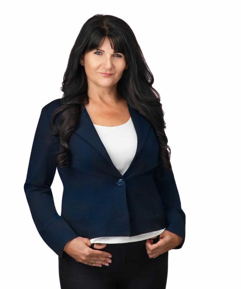 kim rideout in a blue suit jacket with white shirt