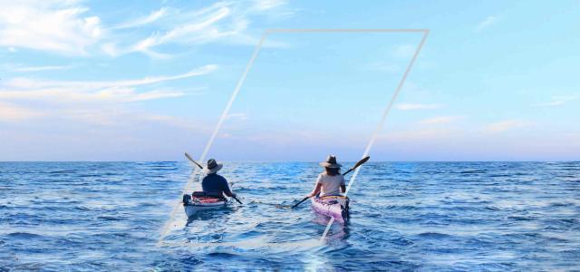 two people kayaking on open lake